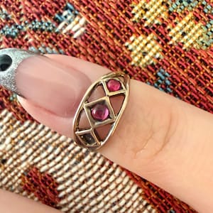 May include: A set of three ceramic mugs with a speckled, cream-colored glaze. Each mug features a different hand-painted floral design in shades of blue, green, and yellow. The mugs are approximately 4 inches tall.