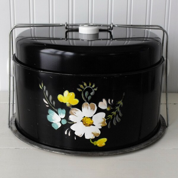 Pretty vintage pie and cake carrier with handle and base, floral motif on black
