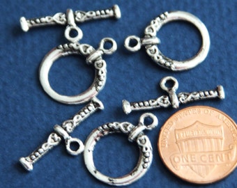 10 set di fermagli a levetta fantasia in argento anticato 18 x 15 mm