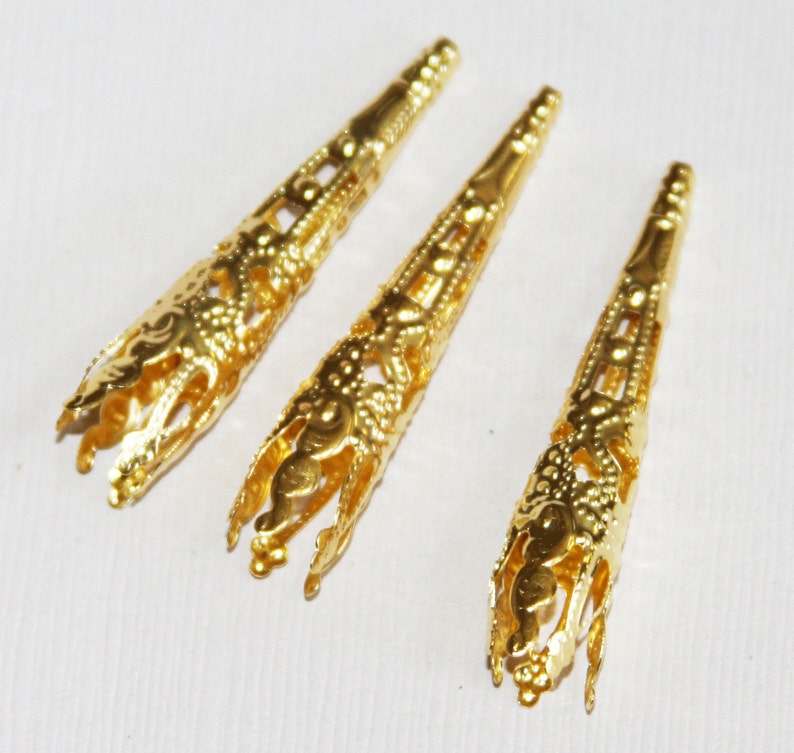 30 pcs of Gold tone finished long filigree cone 41X8mm