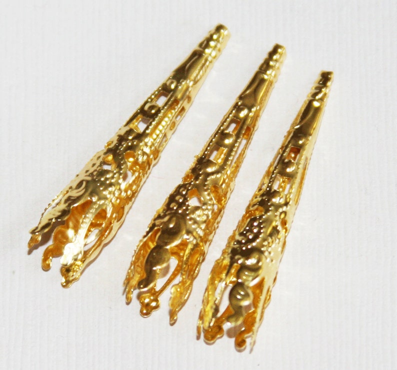 30 pcs of Gold tone finished long filigree cone 41X8mm