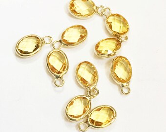 6 pcs   Glass faceted oval with  brass setting 12x7mm clear yellow ,  glass charm, bulk glass charm