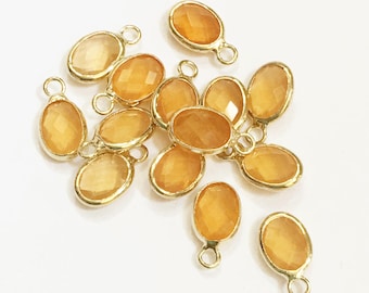 6 pcs   Glass faceted oval with  brass setting 12x7mm  yellow ,  glass charm, bulk glass charm