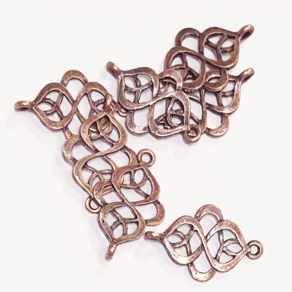 12 antieke koperen wervelconnectoren: roodbronzen schakels (28 x 18 mm)