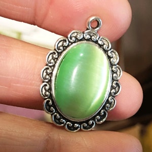 Light Green Glass Cabochon Pendant: Antique Silver Oval Setting (21x29mm)