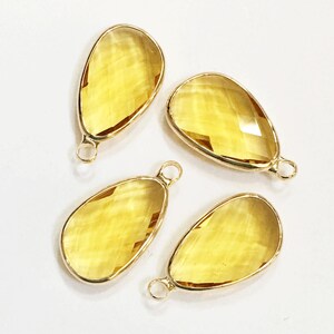 Yellow Faceted Glass Teardrop Pendant with Gold Frame (22x11.5mm)