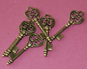 12 piezas de dijes de llave con acabado en latón envejecido de 36 x 11 mm
