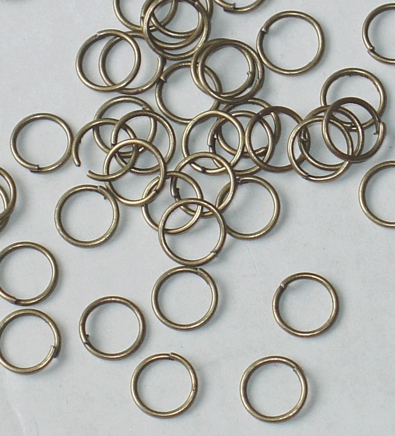 500 pcs of antiqued brass finished jumprings 5mm 16 gauge image 1