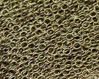 May include: A close-up of a gold chain, showing the individual links and the texture of the metal.