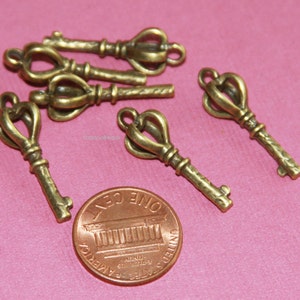 Bulk 30 pcs Antiqued brass finished key charm 26x9mm image 1