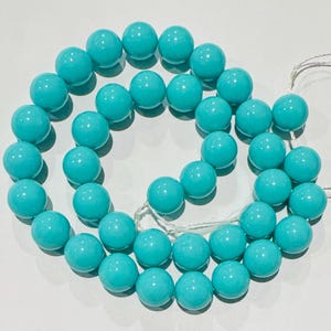 16" South Sea Shell Beads: 10mm Turquoise Round Beads