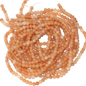 2x16 in strand of peach aventurine round 4mm