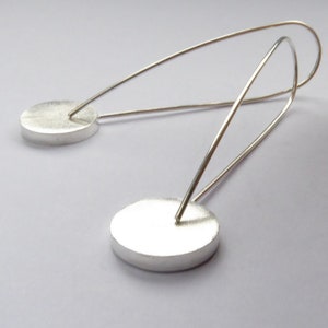 back view of Pop long round recycled Sterling Silver earrings