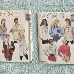May include: Two vintage McCall's sewing patterns featuring illustrations of blouses. The patterns showcase various blouse styles with details like ruffles, pleats, and decorative collars. The patterns are labeled with the numbers 6252 and 6109.