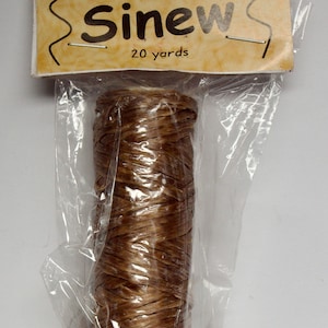 May include: A roll of brown artificial sinew, 20 yards long, packaged in a clear plastic bag with a brown label that reads "Artificial Sinew 20 yards".