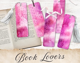 May include: Five printable bookmarks with a watercolor background in shades of pink and purple. The bookmarks feature different designs, including hearts, lips, and bows. The text "Book Lovers" and "5 Printable Bookmarks" is at the bottom of the image.