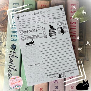 May include: A grey and white printable book review tracker with a black cat illustration. The tracker includes sections for title, author, genre, trope, series, start date, finish date, recommended by, rating, spice rating, format, borrowed from, number of pages, thoughts, favourite quotes, favourite characters, would read again, and would recommend.