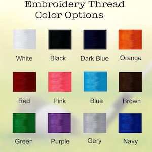 Puede incluir: Una tabla que muestra las opciones de color de hilo para bordar. Los colores son blanco, negro, azul oscuro, naranja, rojo, rosa, azul, marr&oacute;n, verde, morado, gris y azul marino.