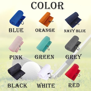Puede incluir: Un conjunto de 10 toallas de golf en varios colores, incluyendo azul, naranja, azul marino, rosa, verde, gris, negro, blanco y rojo. Cada toalla est&aacute; enrollada y tiene un gancho de metal.