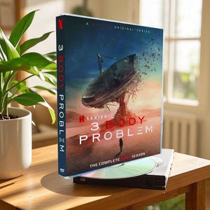 May include: A DVD case for the Netflix series "3 Body Problem". The case features a blue and white image of a large satellite dish with a red text overlay that reads "3 Body Problem".