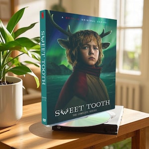May include: DVD case for the Netflix series "Sweet Tooth", featuring a young boy with deer antlers on a green and blue background. The text "Sweet Tooth The Complete Series" is on the front of the case.