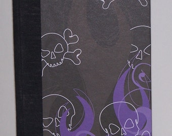 purple and black skull and flame journal