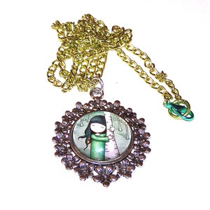 tree hugging girl pendant on green chain
