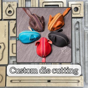 May include: Five leather mouse-shaped coin purses in brown, orange, black, red, and turquoise. Each has a zipper closure and small ears. The image also shows wooden die-cutting templates and the text "Custom die cutting".
