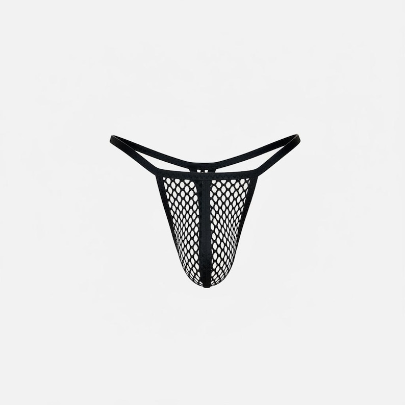 May include: Black fishnet thong underwear. The underwear features a mesh design and thin straps. The garment is designed with a low rise and a minimal back coverage. The thong is made of a stretchy material.