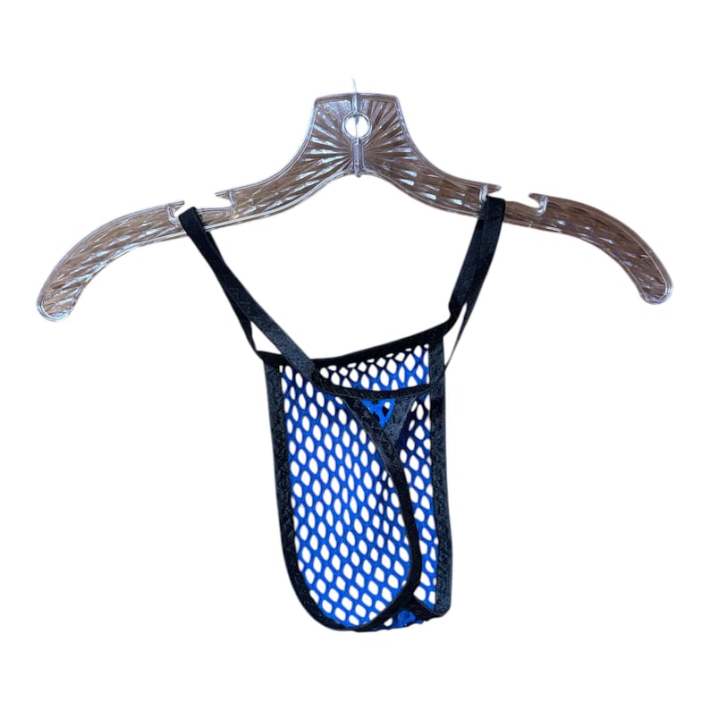 May include: A blue and black mesh thong underwear hanging on a clear plastic hanger. The underwear has a blue interior and a black mesh exterior. The straps are black.