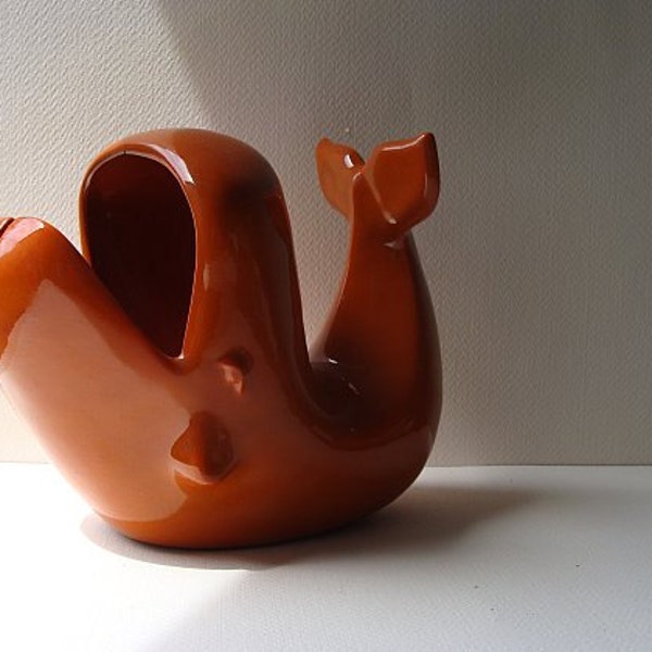 mid century ceramic whale which is orange and quite large