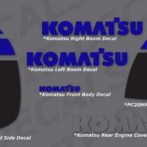 May include: Decals for Komatsu equipment, featuring the brand name and model details. The decals are in blue, white, and yellow on a gray background. Includes text such as "Komatsu Right Boom Decal" and "PC20MR Left Hand Side Decal".