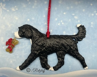 Doodle/Poodle cross w/bone charm. Black and white. Christmas/holiday sculpted dog ornament.