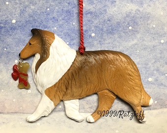 Collie-rough-sable-w/bone-Christmas/holiday artist dog breed ornament by Artdog Ornament.