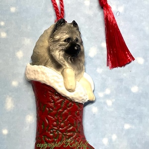 Keeshond stocking ornament! Christmas/holiday sculpted dog breed decor.  Stocking is  red, green textured with shimmery pearl  trim.