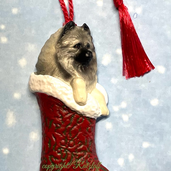 Keeshond stocking ornament! Christmas/holiday sculpted dog breed decor.  Stocking is  red, green textured with shimmery pearl  trim.