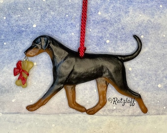Doberman w/ bone charm and natural ears and tail. Black and tan. Artist sculpted dog breed Christmas ornament.