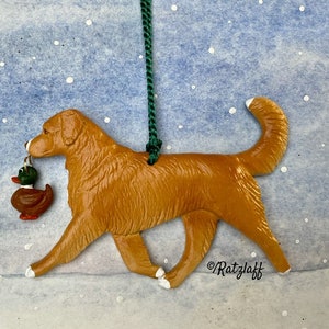 Nova Scotia Duck Tolling Retriever with toy duck. Christmas/holiday handcrafted dog breed ornament.