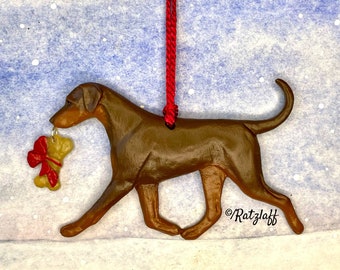 Doberman w/ bone charm and natural ears and tail. Red and Rust. Artist sculpted dog breed Christmas ornament.