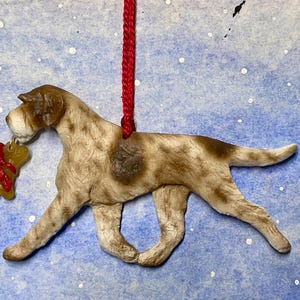 German Wirehaired Pointer w/bone. Artdog Christmas dog breed ornament.