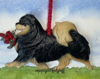 Tibetan Spaniel with tulip charm. Black and tan. Christmas/holiday handcrafted dog breed ornament.