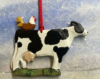 Cow with chicken ornament. Carved look. From 1995. Christmas/holiday decor. Farm animal collector.