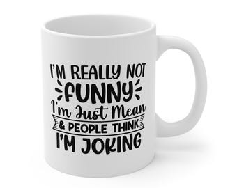 May include: White ceramic mug with a black text design. The text reads: "I'M REALLY NOT FUNNY I'm Just Mean & PEOPLE THINK I'M JOKING". The mug has a curved handle and is suitable for hot or cold beverages.