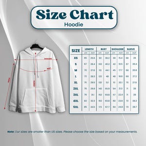 May include: White hoodie with a size chart. The chart provides measurements in inches and centimeters for length, bust, shoulder, and sleeve for sizes XS to 5XL. The text "Size Chart Hoodie" is at the top.