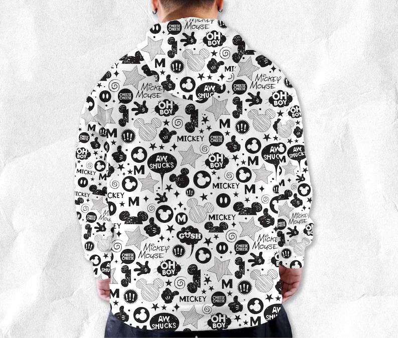 Peut inclure: Sweat &agrave; capuche blanc avec un motif noir de Mickey Mouse. Le design comprend des silhouettes de Mickey Mouse, des &eacute;toiles, des bulles et des textes comme "Mickey Mouse", "Oh Boy" et "Aw Shucks".