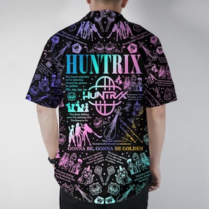 May include: Black short-sleeve button-down shirt with a colorful graphic design. The design includes the word "HUNTRIX" in a gradient font, along with illustrations and text. The shirt has a classic collar and short sleeves.