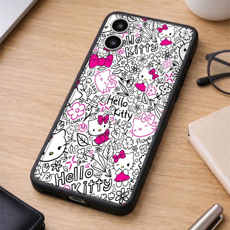 May include: Black phone case featuring a white and pink Hello Kitty design. The case has a black border and a repeating pattern of Hello Kitty, flowers, and leaves. The words "Hello Kitty" are also visible.