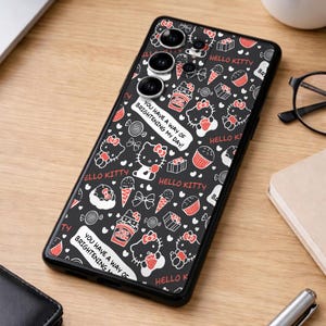 May include: Black phone case featuring a repeating pattern of Hello Kitty characters, sweets, and bows in red and white on a black background. The case includes the text "You have a way of brightening my day!"