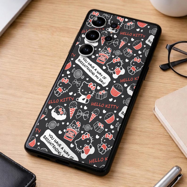 May include: Black phone case featuring a repeating pattern of Hello Kitty characters, sweets, and bows in red and white on a black background. The case includes the text "You have a way of brightening my day!"