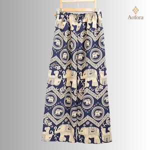 May include: Navy blue palazzo pants with an all-over pattern of cream-colored elephants and circular medallions. The pants are hanging on a wooden hanger. The brand name "Aofora" is in the upper right corner.